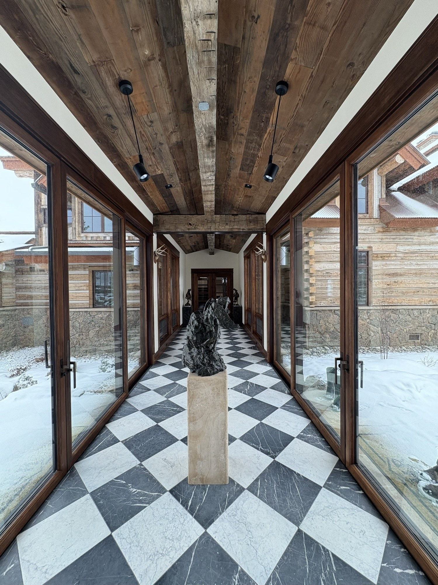 Finished timber and glass breezeway craftsmanship completed by our crew