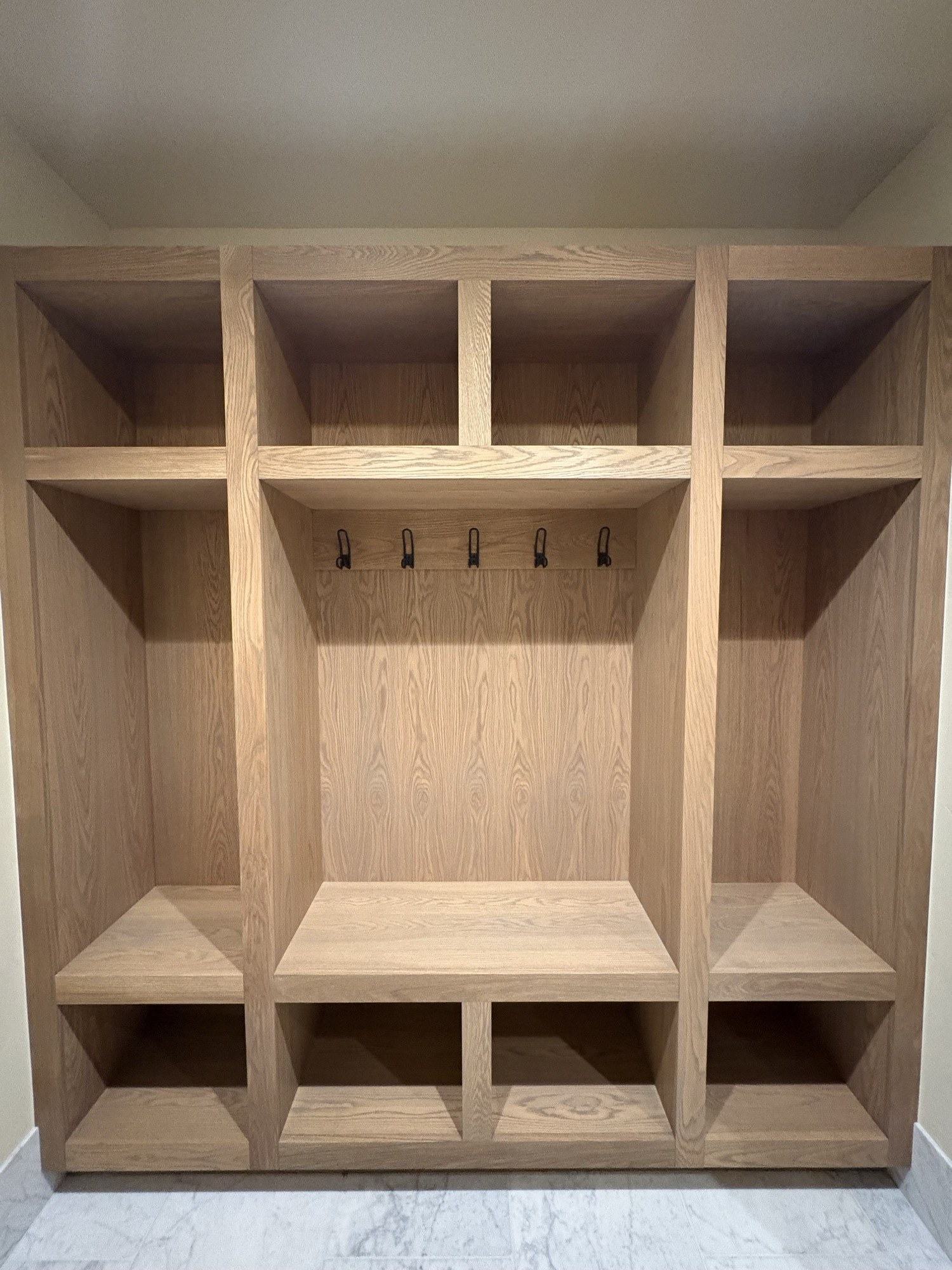 Finished custom white-oak built-ins completed by our crew