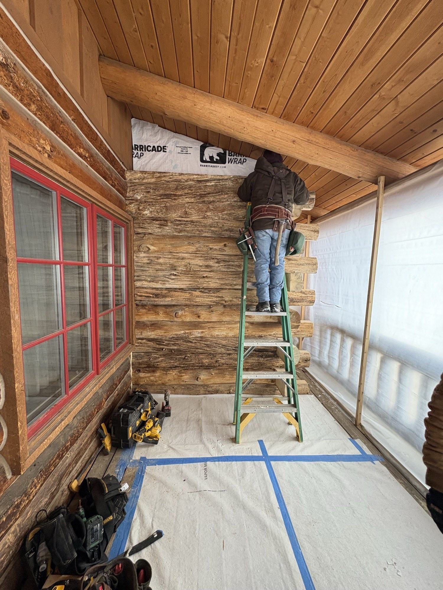Our crew installing siding on a mountain home — work completed by our crew
